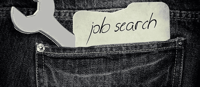 Denim pocket with a wrench sticking out and and a note reading job search | Severance Pay and Employment Insurance