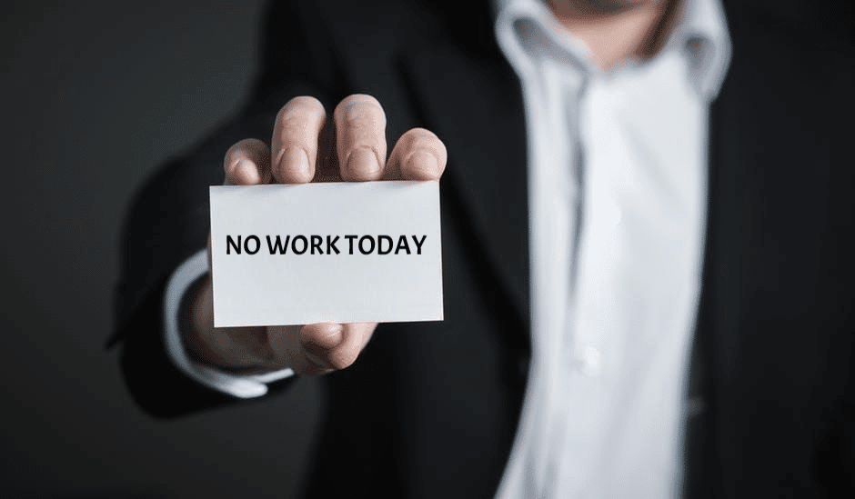 Insolvency Layoffs | Bankruptcy | torso of a man holding a sign that says no work today