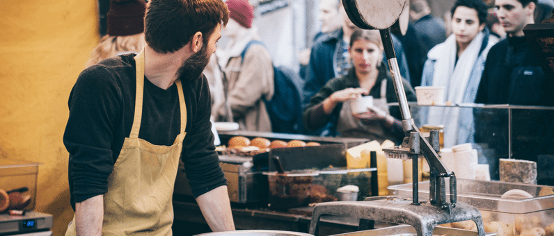 Part-time Workers | Fast food worker looking at a line up of customers